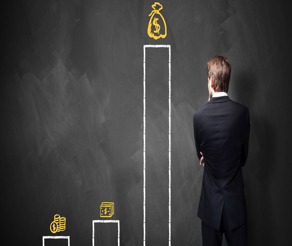 Business traveller looking at a rising growth chart